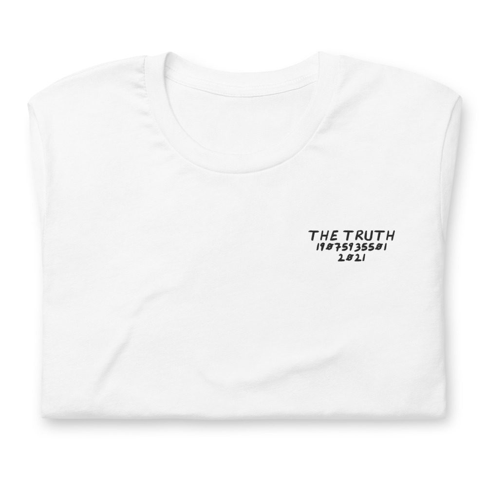Its shirt, folded: a white tee with the record embroidered on the chest