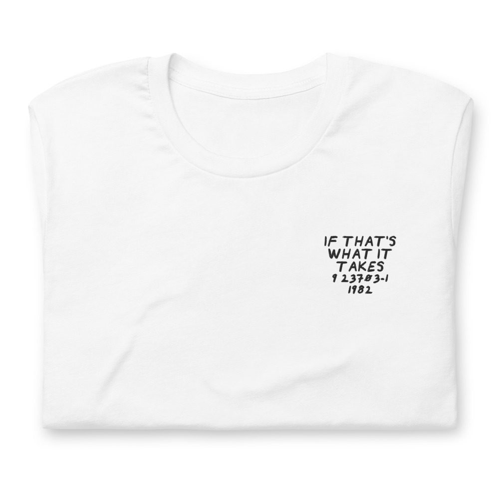 Its shirt, folded: a white tee with the record embroidered on the chest