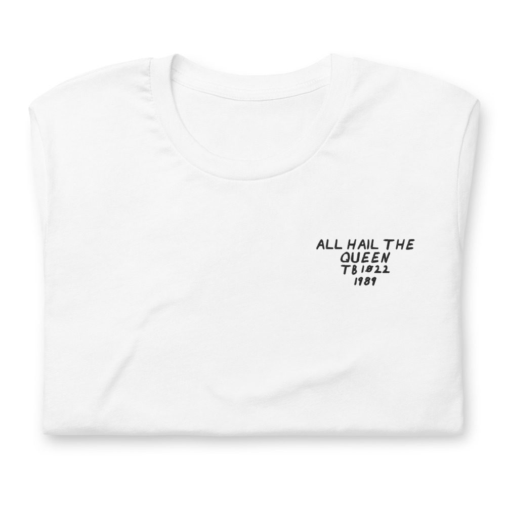 Its shirt, folded: a white tee with the record embroidered on the chest