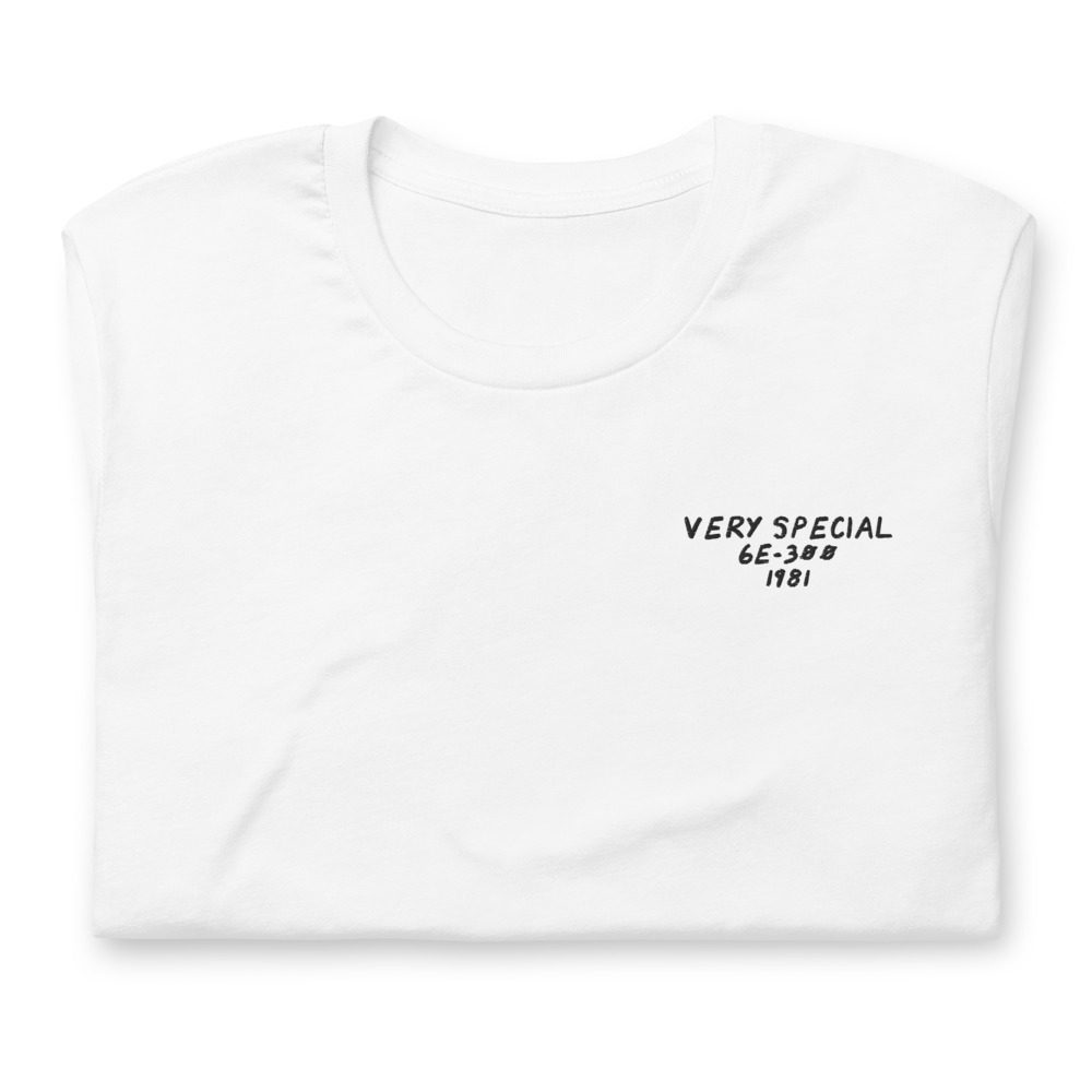 Its shirt, folded: a white tee with the record embroidered on the chest