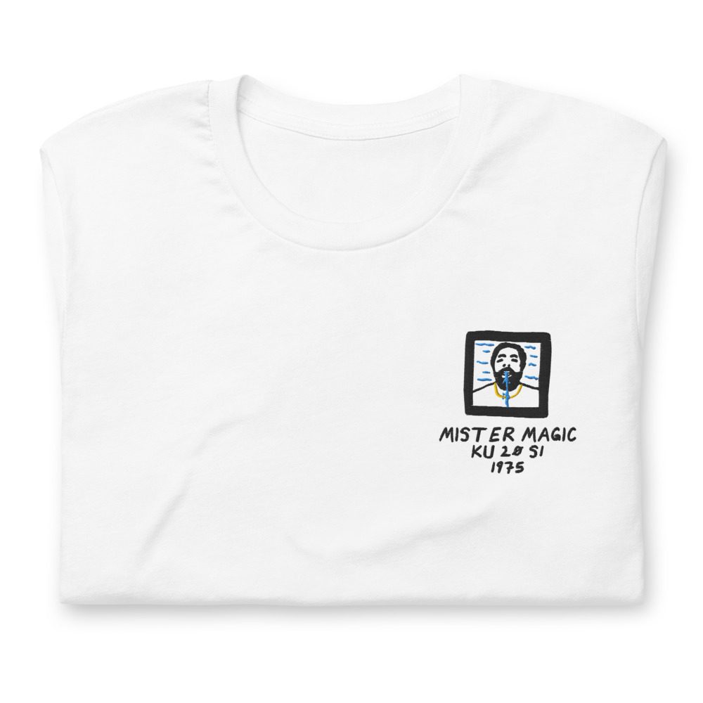 Its shirt, folded: a white tee with the record embroidered on the chest