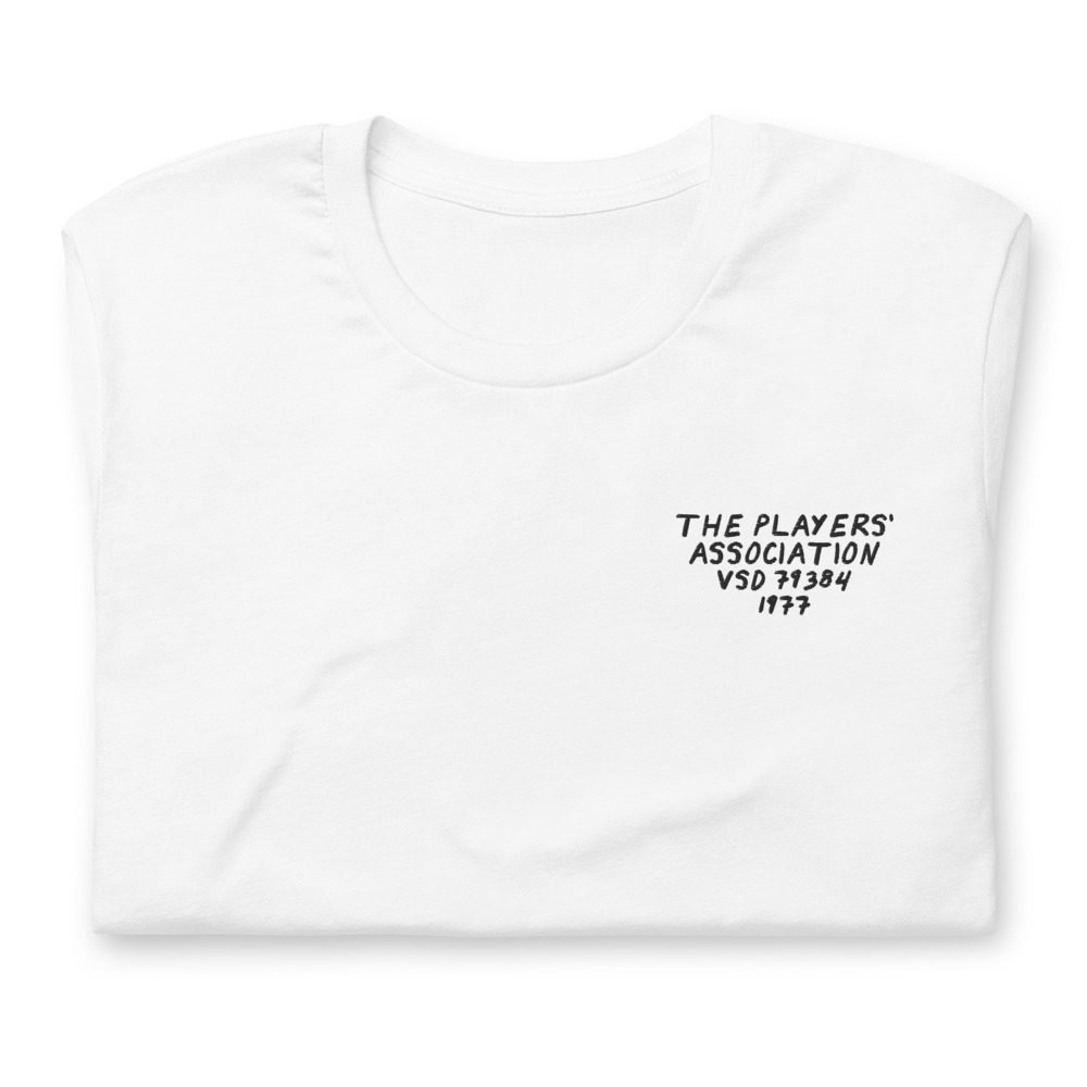 Its shirt, folded: a white tee with the record embroidered on the chest
