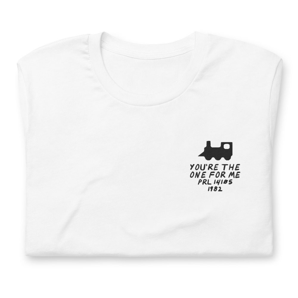 Its shirt, folded: a white tee with the record embroidered on the chest