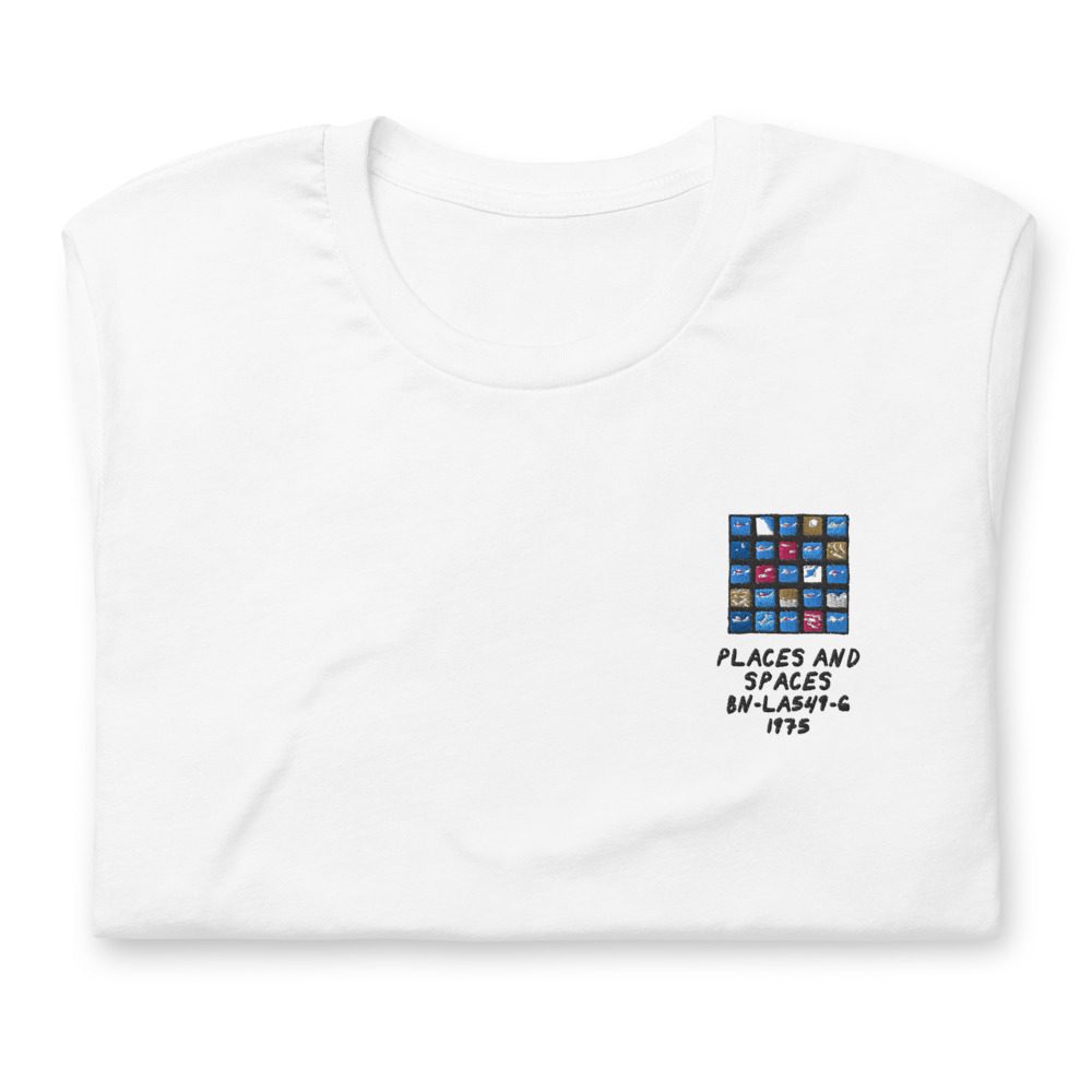 Its shirt, folded: a white tee with the record embroidered on the chest