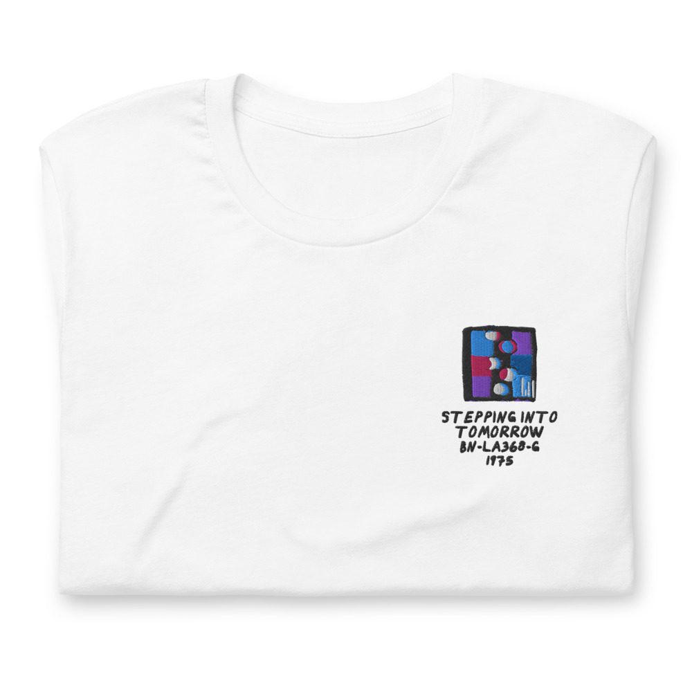 Its shirt, folded: a white tee with the record embroidered on the chest